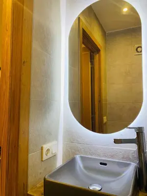 a bathroom with a sink and a mirror at 1 bedroom apartment Miramas 2, gueliz in Marrakech