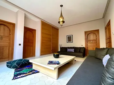 a living room with a couch and a coffee table at Villa Serenity Marrakech in Châba
