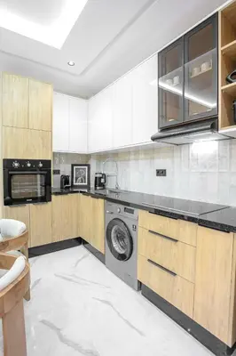 a kitchen with a washer and dryer in it at The Crown Edition - Hivernage Marrakech in Marrakech