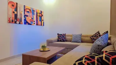 a living room with a couch and a table at Appartement Aéroport Stay Marrakech-M9 in Marrakech