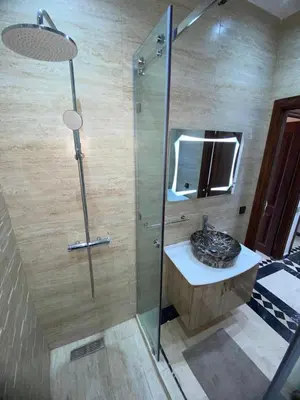a bathroom with a sink and a shower at Elegance and comfort in the heart of Marrakech in Marrakech