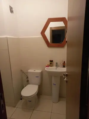 a bathroom with a toilet and a sink at Marrakech in Marrakech