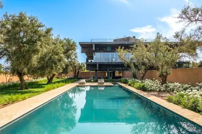 a swimming pool in the backyard of a house at Villa Tacai in Graoua