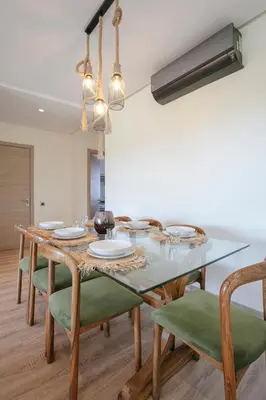 a dining room with a table with plates and chairs at Saphire Luxury - Marrakech- Prestigia in Marrakech