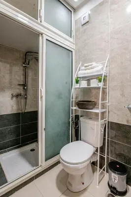 a bathroom with a toilet and a shower at Moroccan Comfort & Charm - 10 min from Guéliz in Marrakech