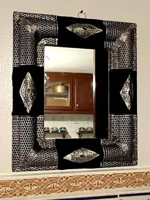 a mirror on a bathroom counter with a sink at Riad Serenity Palmeraie in Marrakech