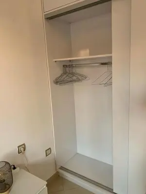 a walk in closet with a glass door at Studio Stay Marrakech in Marrakech