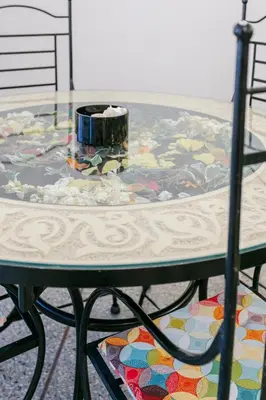 a glass table with a candle on top of it at 2BR Art Deco Loft - Central Gueliz Marrakech in Marrakech