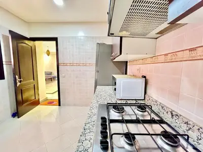 a kitchen with a stove and a counter top at Perfect stay in Guéliz Book now! in Marrakech