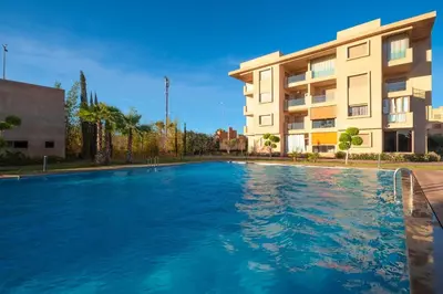 a large swimming pool in front of a building at La Bella Casa - Private Pool in Marrakech