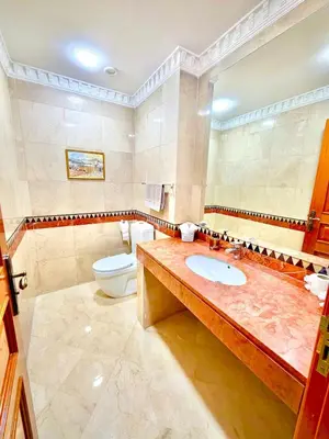 a bathroom with a sink and a toilet at Appartement Plaza Centre in Marrakech