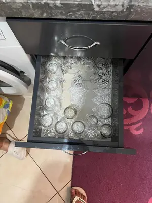 a drawer with a bunch of silver dishes in it at Modern apartment in the heart of Marrakech, just 9 minutes from the airport in Marrakech