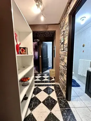 a bathroom with a black and white checkered floor at Charming apartment with a traditional style in Marrakech