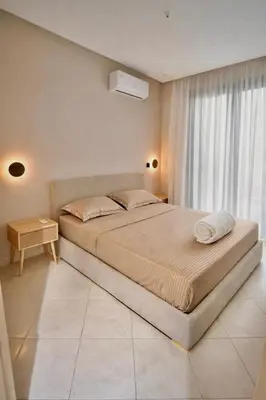 a bedroom with a large bed and a window at M&O airport appartment in Marrakech