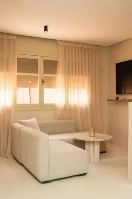 a living room with a couch and a table at Studio de reve au Coeur de Marrakech in Marrakech