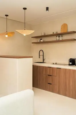 a kitchen with wooden cabinets and a sink at Studio de reve au Coeur de Marrakech in Marrakech