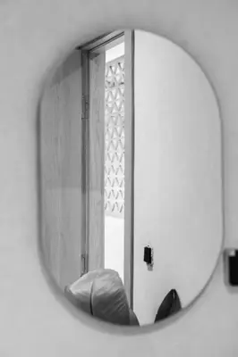 a mirror in a bathroom with a window at Studio de reve au Coeur de Marrakech in Marrakech