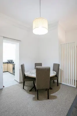 a dining room with a table and chairs at Art Deco Loft 1BR Central Guéliz Marrakech in Marrakech