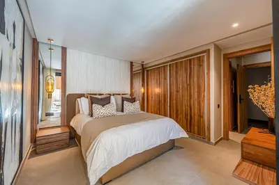 a bedroom with a large bed in a room at L'Amira - Super Apartment with Terrace - 2 people - Wifi in Marrakech
