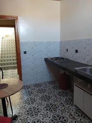 a kitchen with a sink and a counter top at Dar Kawtar in Marrakech