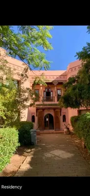a large house with a driveway in front of it at Pure havre de paix à Marrakech in Marrakech