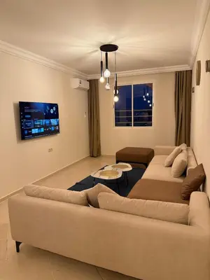 a living room with a couch and a table at Pas disponible in Marrakech