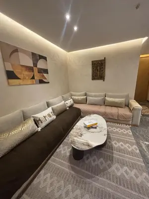 a living room with a couch and a coffee table at Elite garden in Marrakech