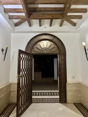 an open door into a hallway with a ceiling at Luxury apartment with swimming pool, Hivernage in Marrakech