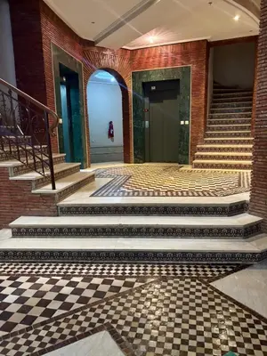 a lobby with stairs and a checkered floor at Luxury apartment with swimming pool, Hivernage in Marrakech