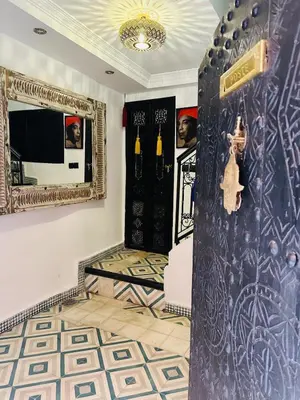 a room with a black door and a mirror at Riad Bayas - Comfort & Authenticity in Marrakech