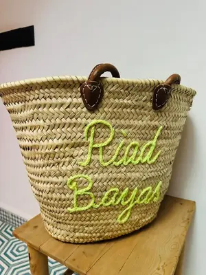 a rattan basket with a sign that reads paid java at Riad Bayas - Comfort & Authenticity in Marrakech