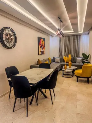 a living room with a table and a couch at דירה