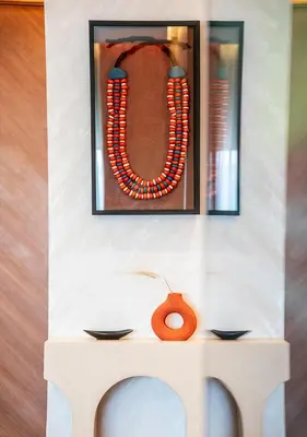a picture of a necklace on a wall at Terracotta Stay - Free parking in Marrakech