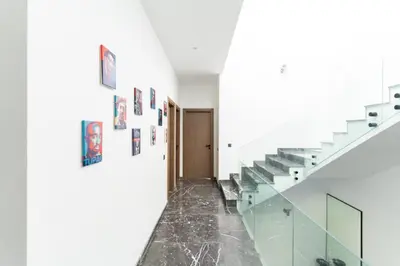 a staircase in a house with a glass floor at Luxury Villa with Heated Pool & Private cinema in Marrakech