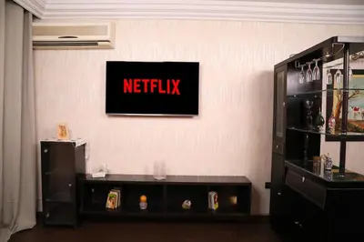 a wall with a netflix sign on a wall at Central terrace XXL - Carré Eden - smart Lock in Marrakech