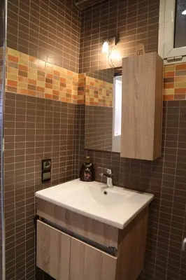 a bathroom with a sink and a mirror at Central terrace XXL - Carré Eden - smart Lock in Marrakech