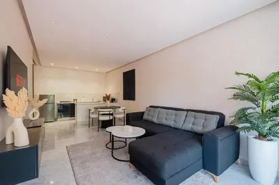 a living room with a couch and a table at Modernite et Bien Etre au Coeur de la Ville in Marrakech