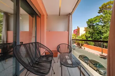 two chairs on a balcony with a view of a street at Modernite et Bien Etre au Coeur de la Ville in Marrakech