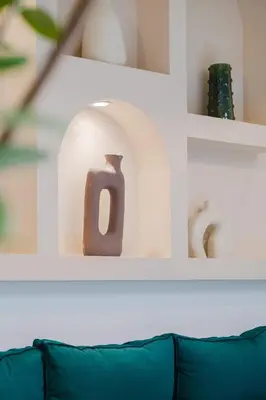 a shelf with vases and vases on it at Riad Imrani - piscine - 6 mn from Jamaa Al Fna in Marrakech