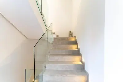 a staircase in a house with a glass case at Villa Nayma in Marrakech
