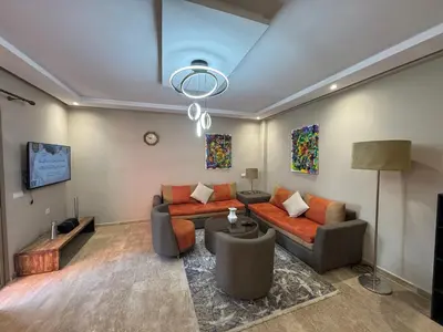 a living room with a couch and a table at Opera 3 in Marrakech