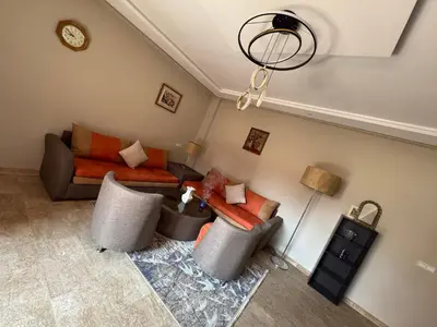 a living room with a couch and a table at Opera 3 in Marrakech