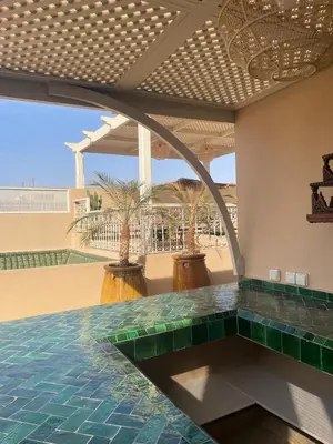 a room with a pool with green tiles on the floor at Riad 4 chambres, Piscine, Pdj inclus in Marrakech