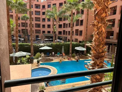 a view of a swimming pool in a hotel at Caprice Palace in Marrakech