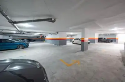 a parking garage with two cars parked in it at Gueliz Harmony in Marrakech