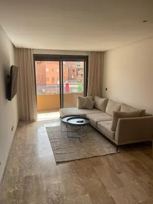 a living room with a couch and a table at Gueliz Harmony in Marrakech