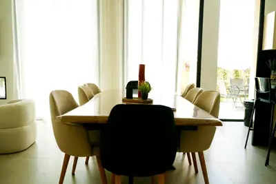 a dining room with a table and chairs at Villa Lily in Tameslouht