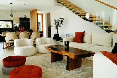 a living room with a white couch and a table at Villa Lily in Tameslouht