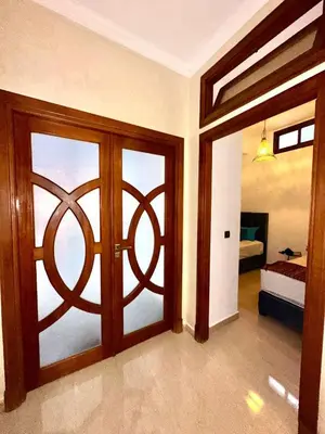 a room with a door with a view of a bedroom at Villa Amroth in Marrakech