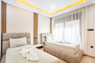 a hotel room with two beds and a couch at Atlas Light Heart of Gueliz & Parking in Marrakech